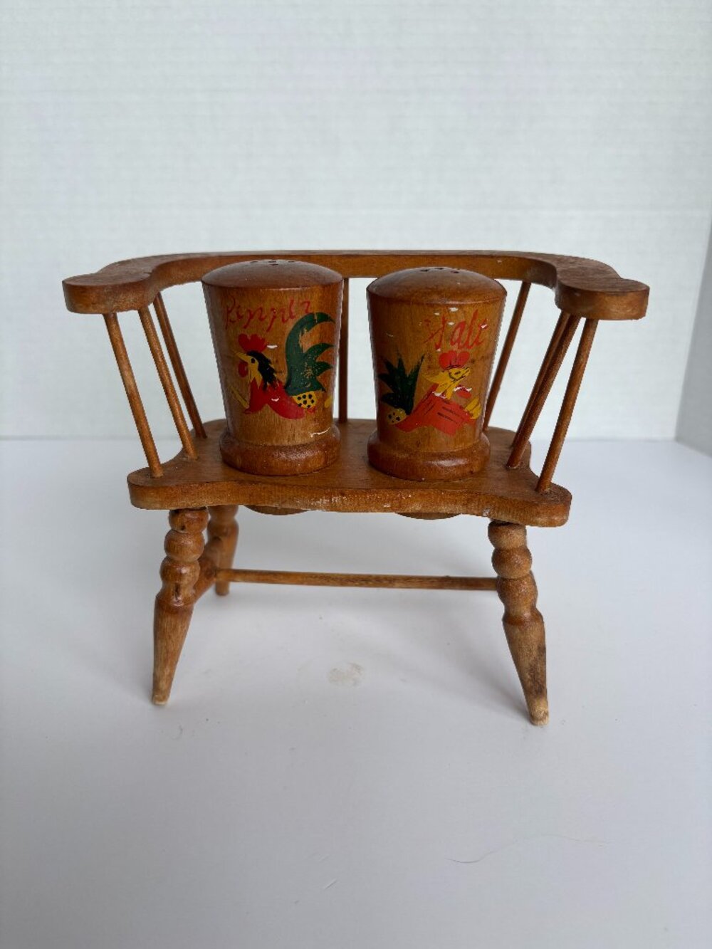 Vintage Wooden Rooster Themed Salt and Pepper Shakers on Wooden Chair
